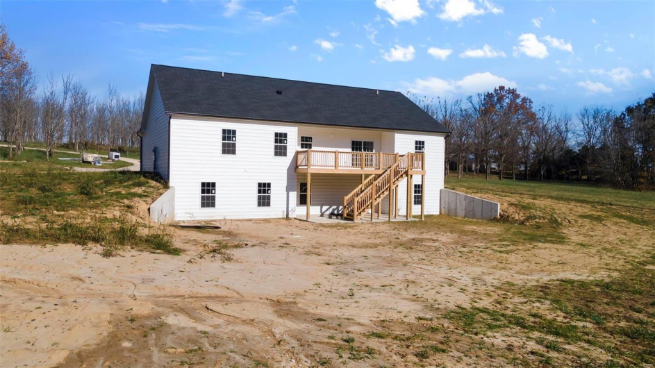 Rear view of property with a wooden deck
