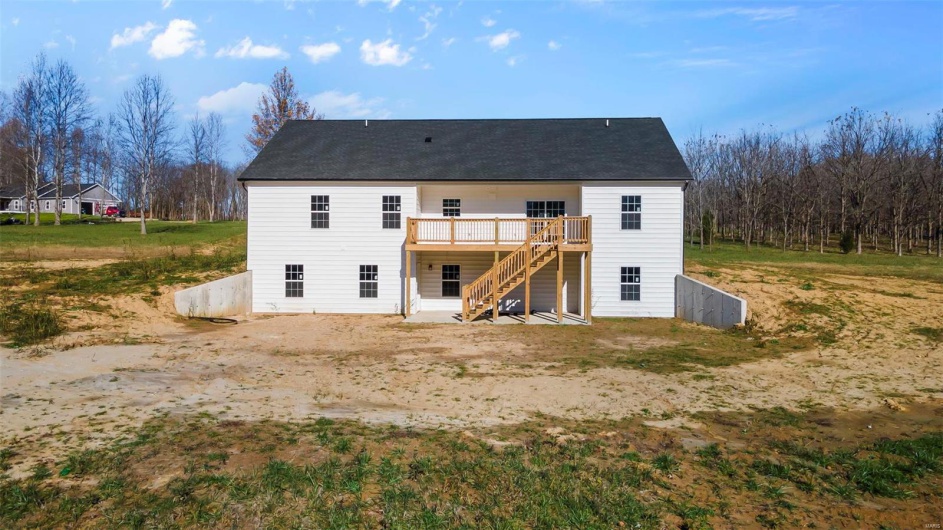 Rear view of house with a wooden deck
