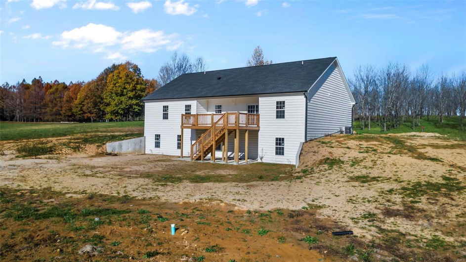 Rear view of house featuring a deck