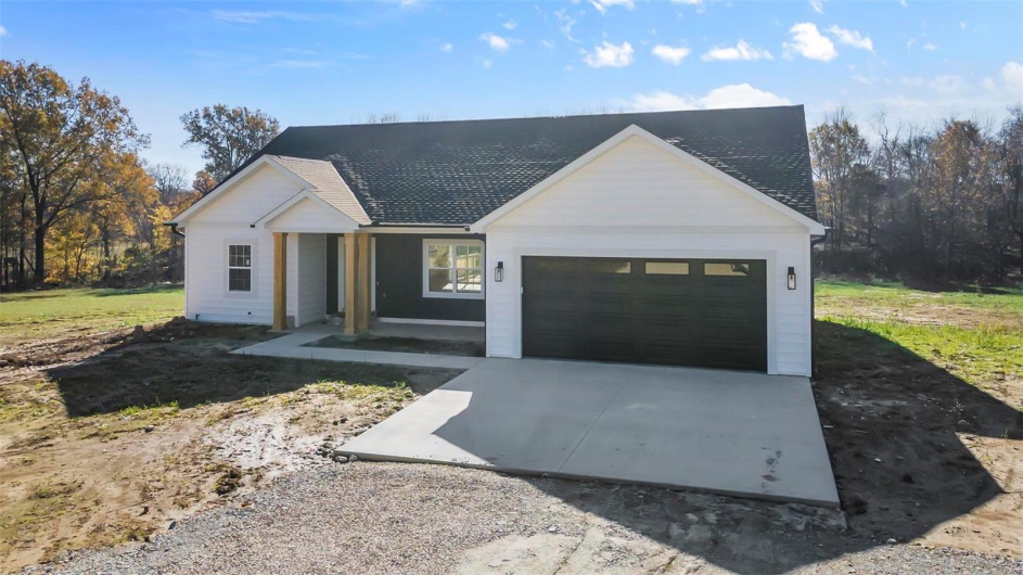 Modern farmhouse featuring a garage