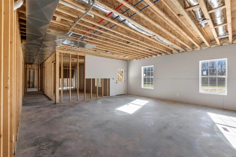 Misc room with concrete floors and a wealth of natural light