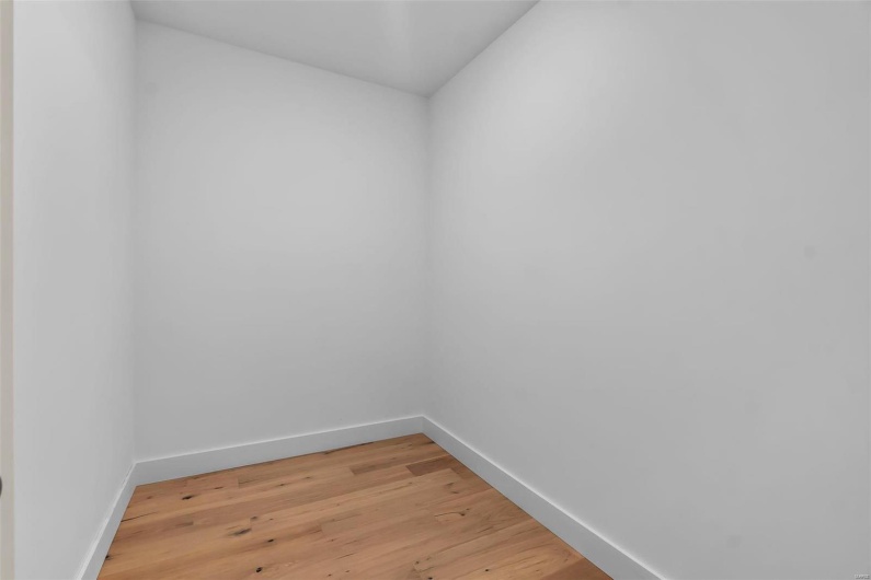 Empty room with wood-type flooring