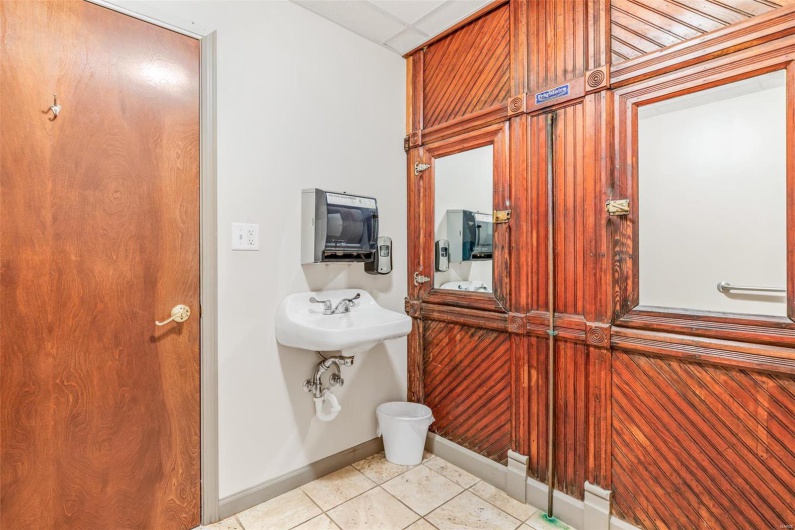 Bathroom with sink and tile patterned floors