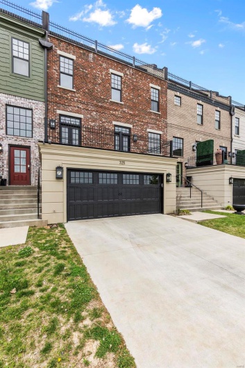 View of front facade featuring a garage
