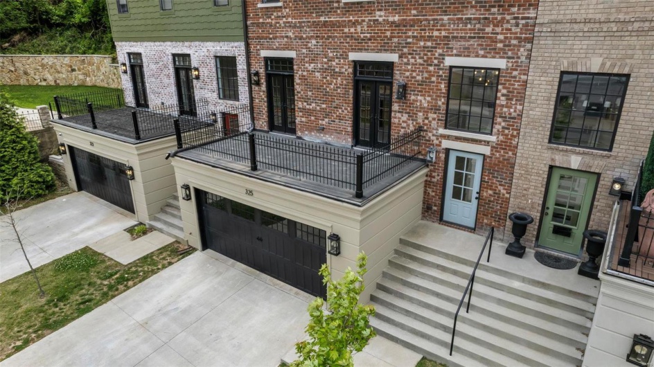 View of front of home with a balcony and a garage