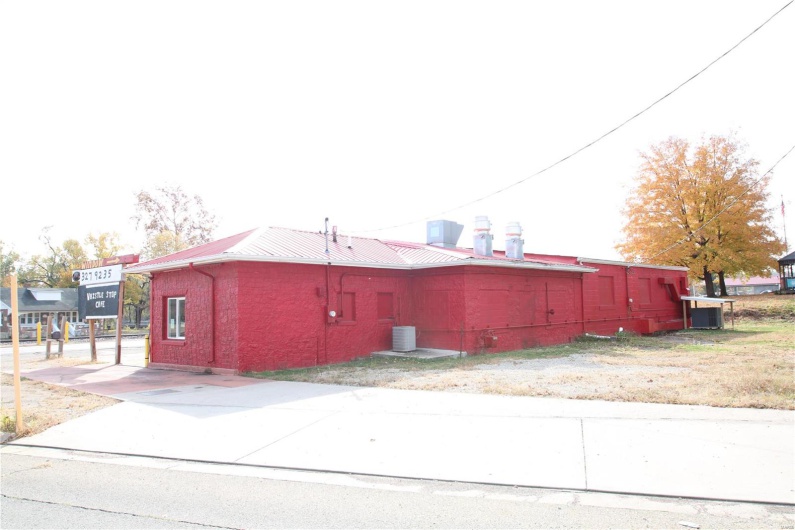 View of side of property featuring central AC unit