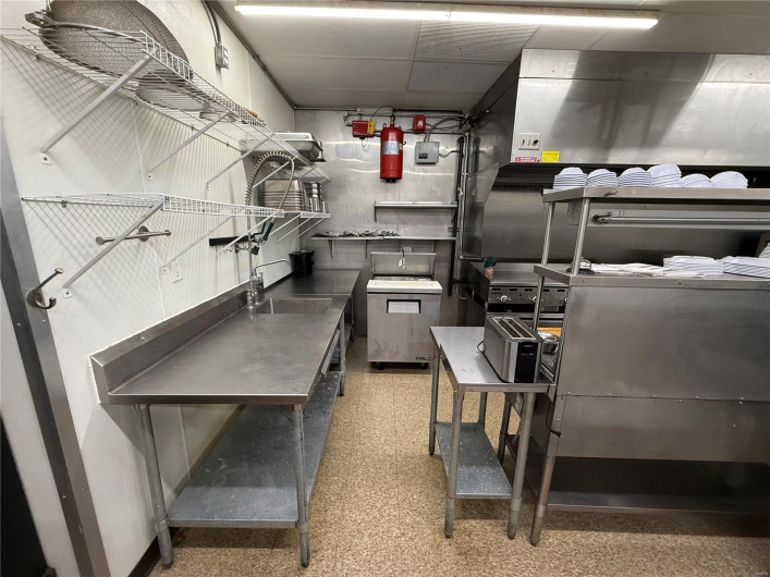 Kitchen with a sink and stainless steel counters