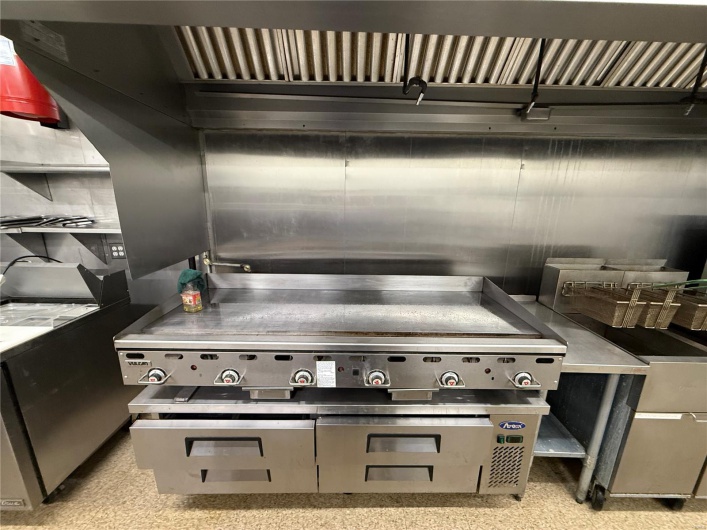 Kitchen featuring stainless steel countertops
