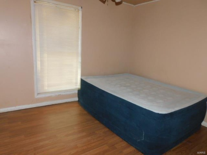 Bedroom featuring hardwood / wood-style flooring
