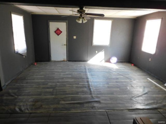 Unfurnished room featuring ceiling fan