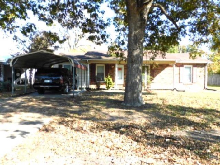 Single story home with a carport