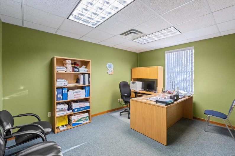 LL Suite 101 Carpeted office featuring a paneled ceiling