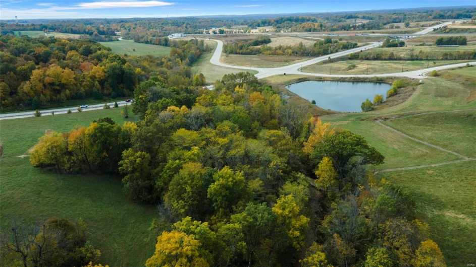 Bird's eye view with a water view and a rural view