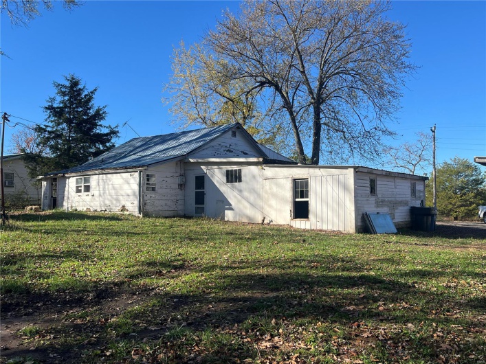 Rear view of house with a lawn