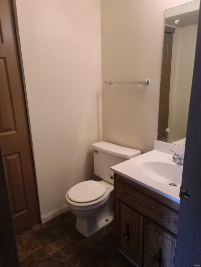 Bathroom with vanity and toilet