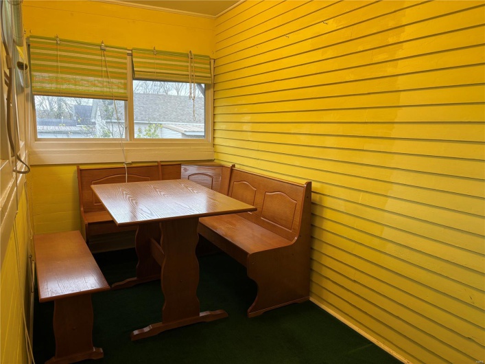 breakfast  area or sun room  with wooden walls