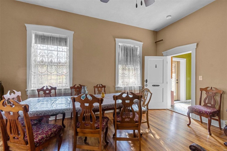 Dining area featuring ceiling fan and wood-type flooring