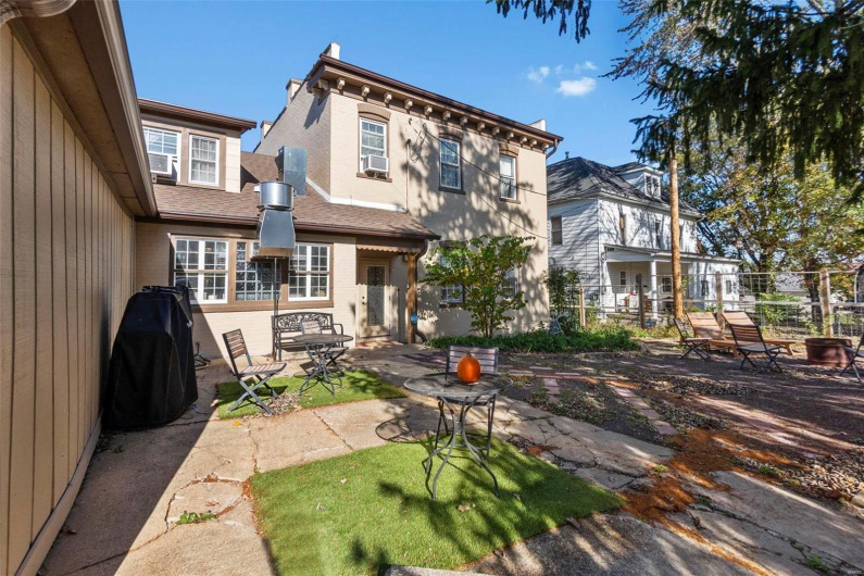 Back of house featuring a patio and cooling unit