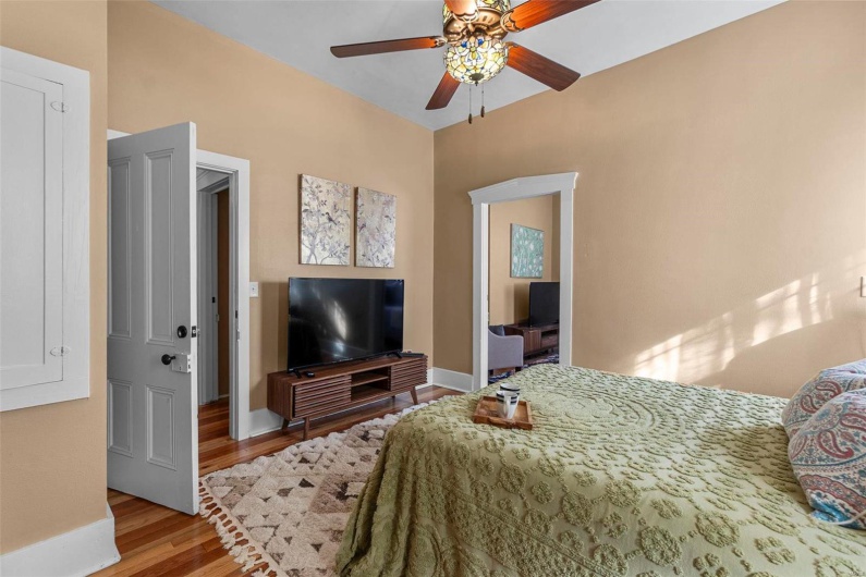Bedroom featuring light hardwood / wood-style floors and ceiling fan
