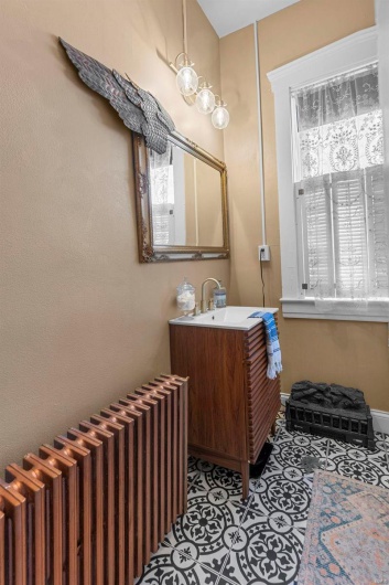 Bathroom with vanity and radiator