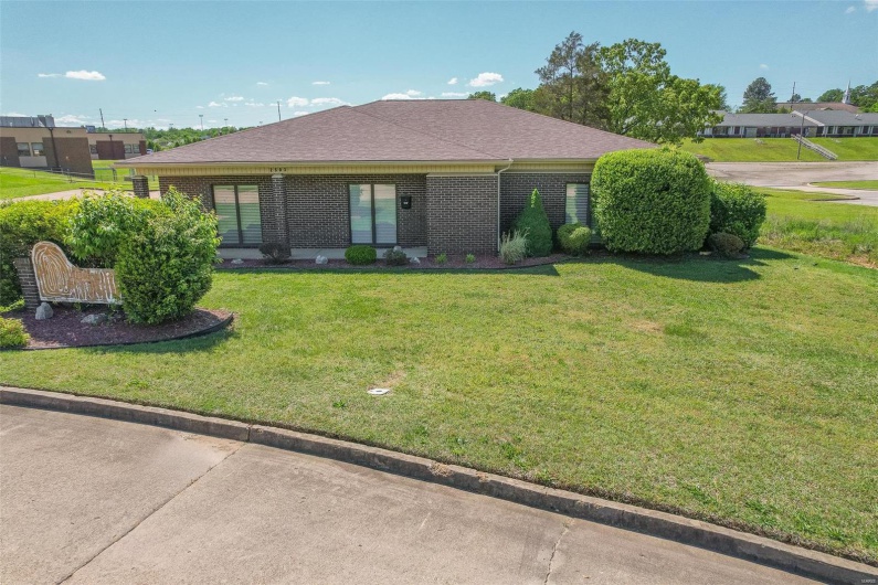 Single story home featuring a front lawn