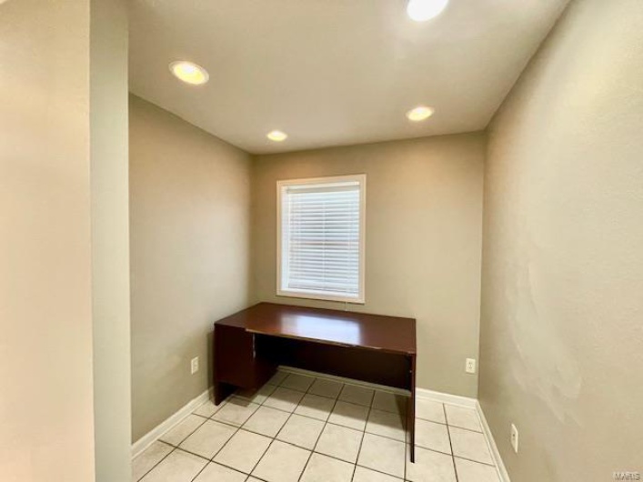 Unfurnished office featuring light tile patterned floors