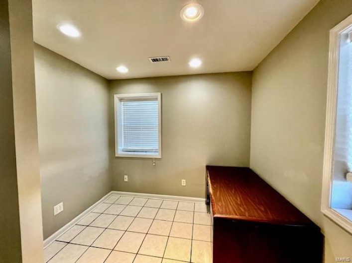 Interior space with light tile patterned floors