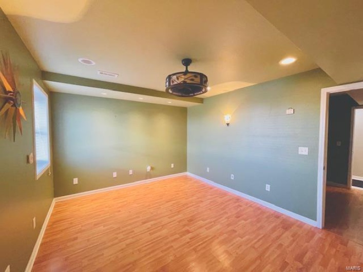 Empty room featuring hardwood / wood-style floors