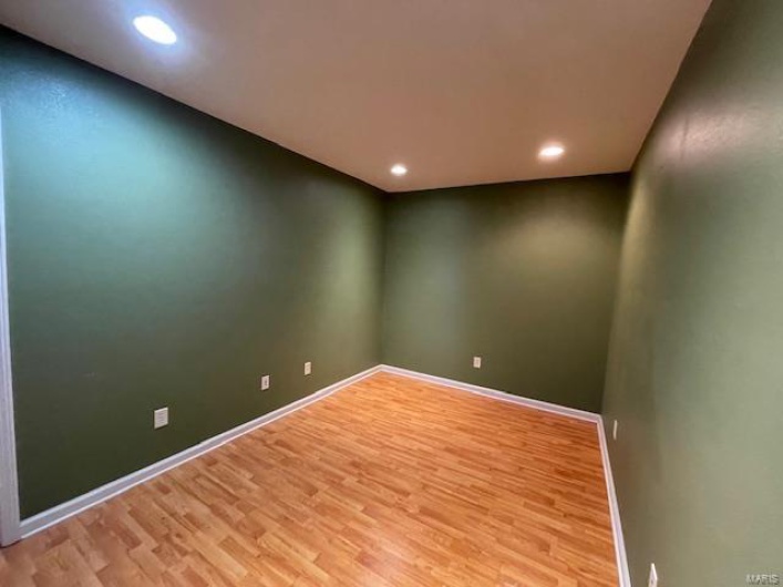 Unfurnished room featuring light wood-type flooring
