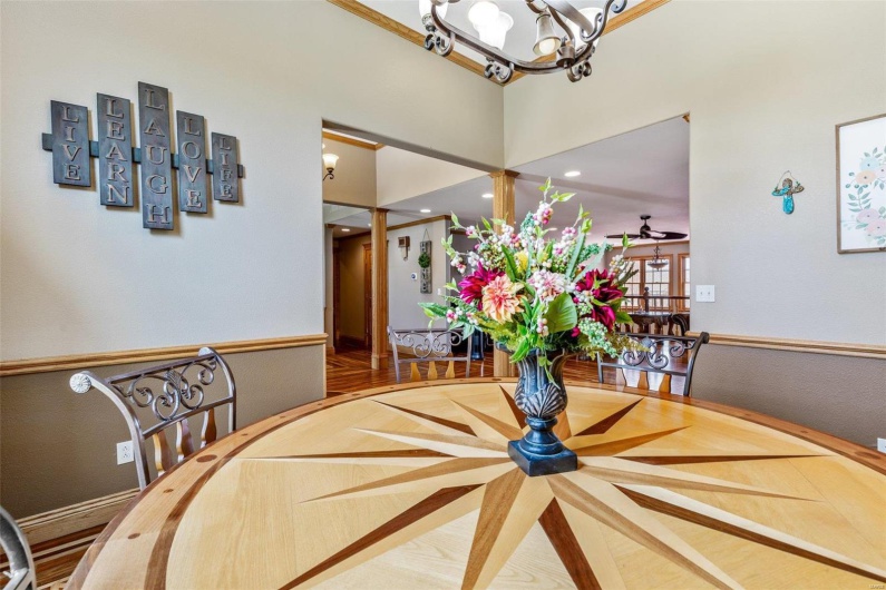 Dining area with wood-type flooring and ceiling fan