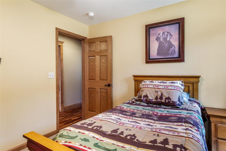 Bedroom with hardwood / wood-style flooring
