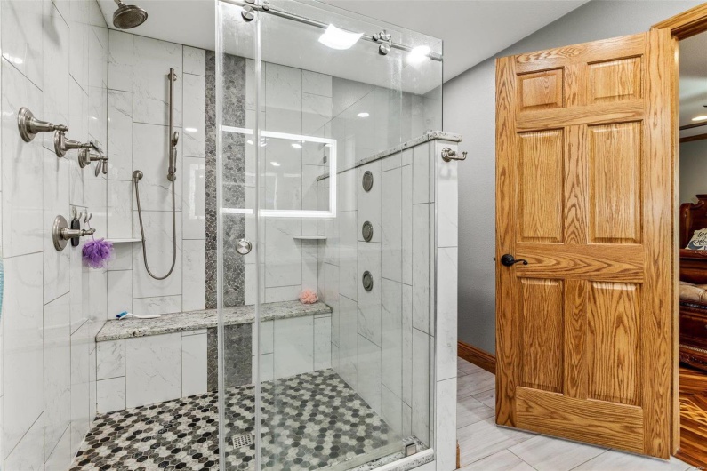 Bathroom with a shower with shower door