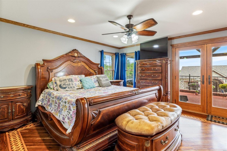 Bedroom featuring access to exterior, french doors, light hardwood / wood-style floors, and ceiling fan