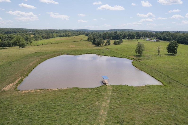 Aerial view featuring a rural view and a water view