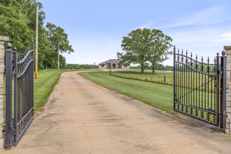 View of gate featuring a yard