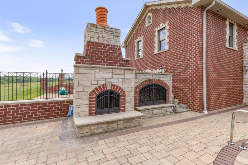 View of patio / terrace with an outdoor stone fireplace