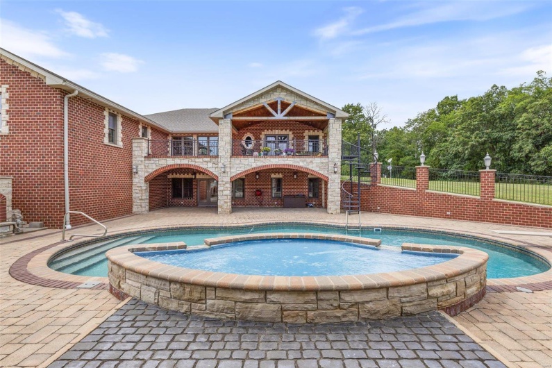View of swimming pool featuring an in ground hot tub, a patio, and pool water feature
