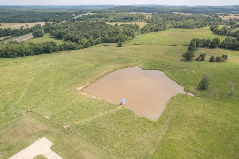 Aerial view featuring a water view and a rural view
