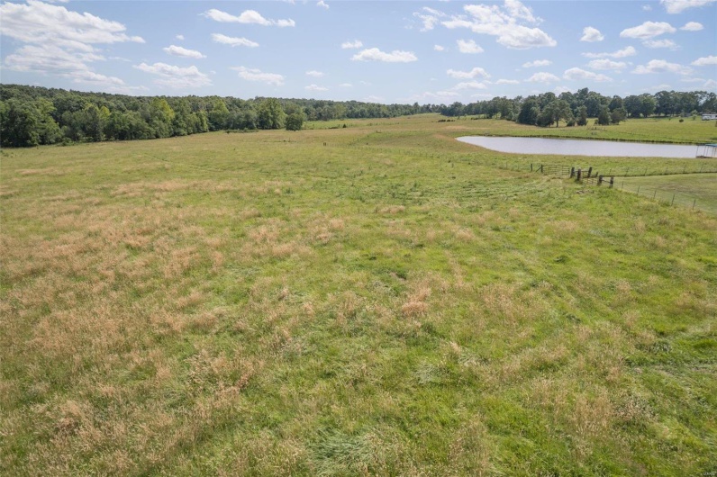 View of yard with a water view and a rural view