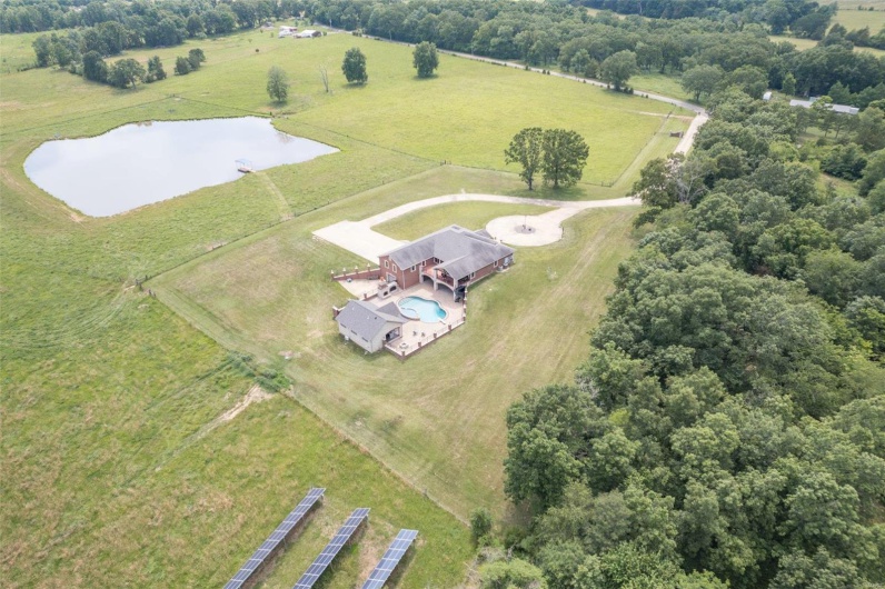 Aerial view featuring a rural view and a water view