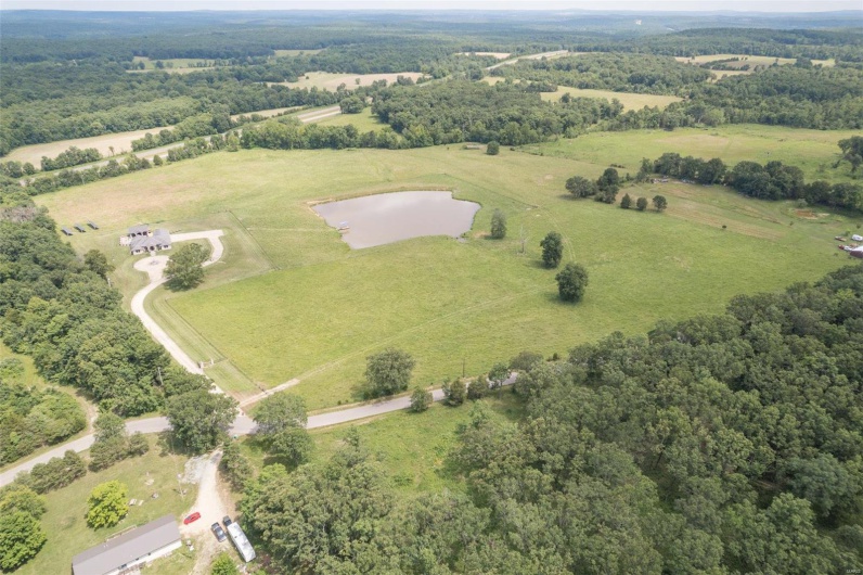 Birds eye view of property featuring a rural view