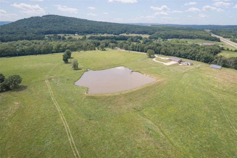 Bird's eye view with a water view and a rural view