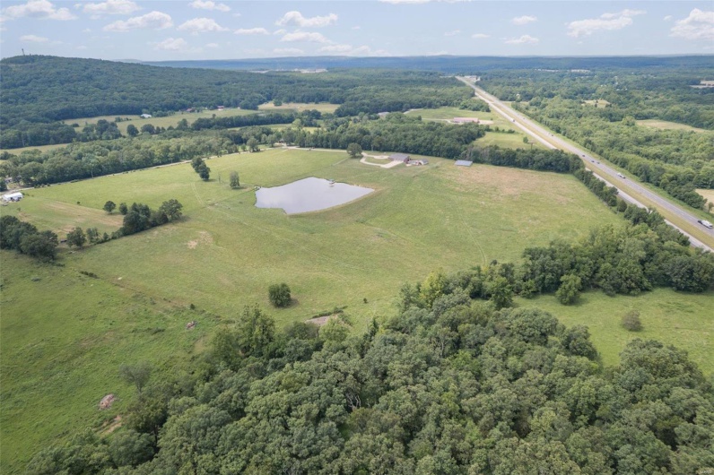 Birds eye view of property featuring a rural view