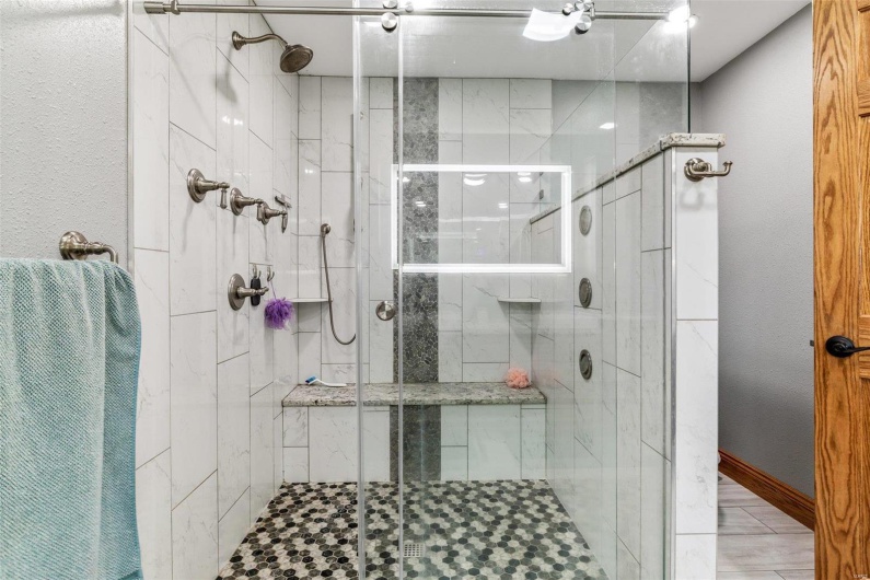Bathroom featuring a shower with shower door