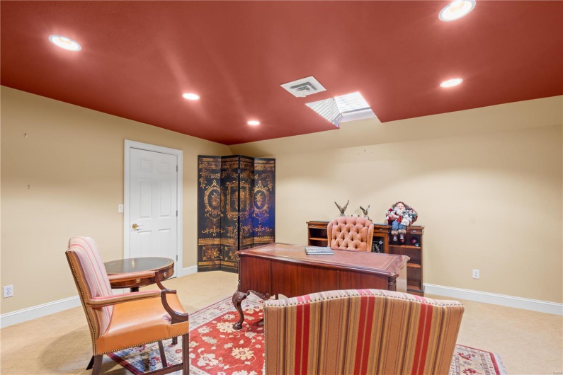 Office space featuring light colored carpet