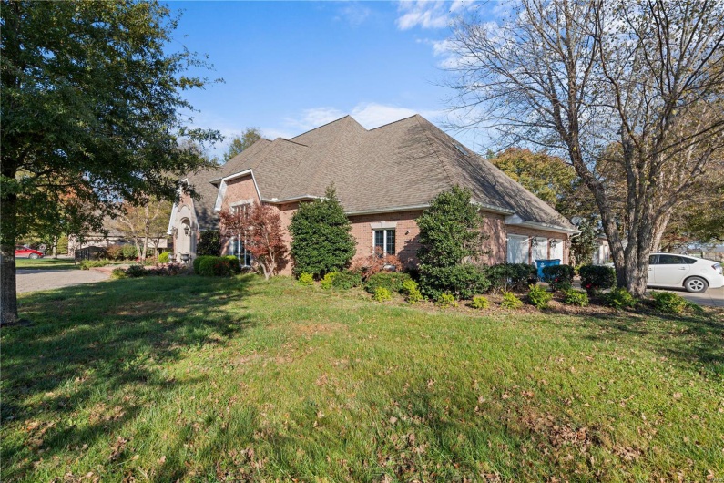 View of home's exterior with a yard