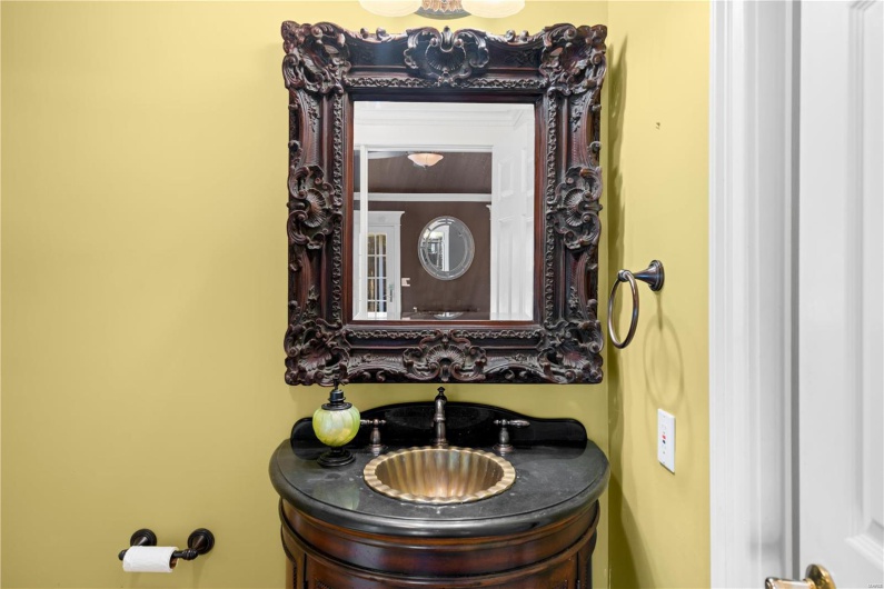 Bathroom with vanity and ornamental molding