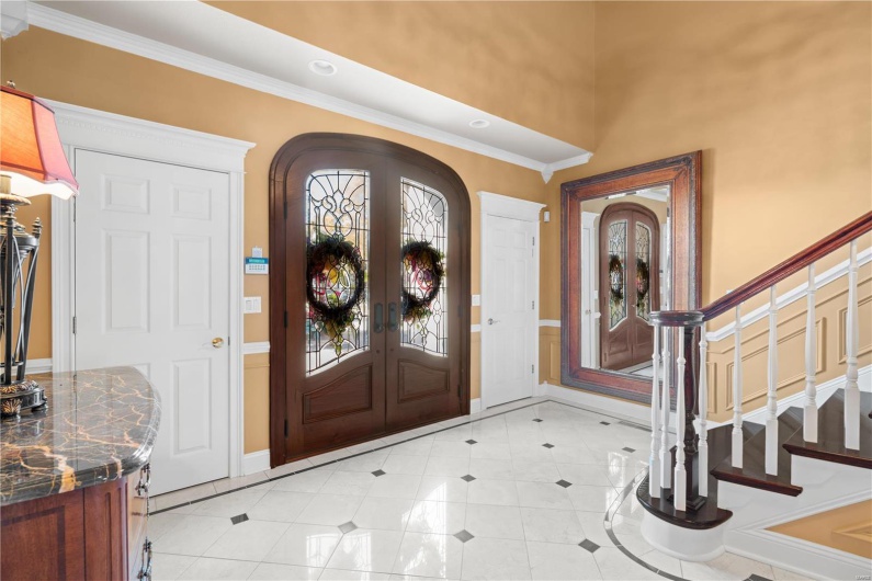 Entryway with french doors and crown molding