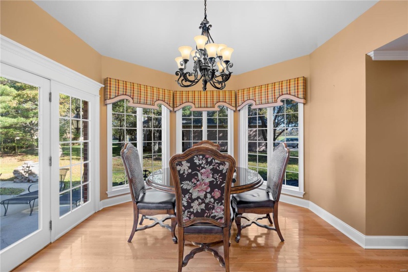 Sunroom / solarium featuring a wealth of natural light and a notable chandelier