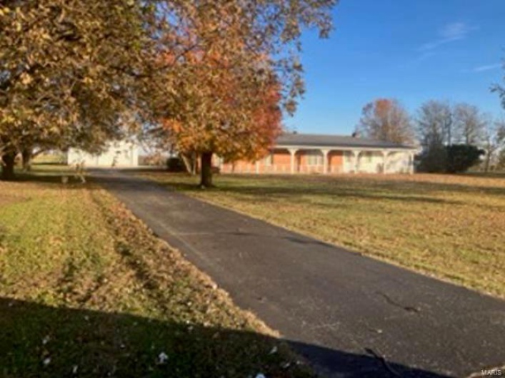 View of front of property with a front lawn
